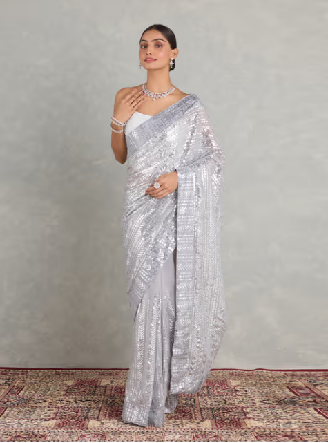 Nyri Silver Georgette Embellished Sequined Beads and Stones Saree and Unstitched Blouse