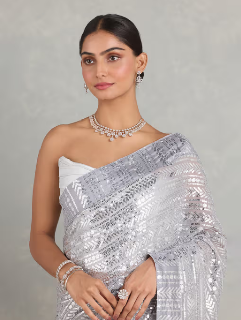 Nyri Silver Georgette Embellished Sequined Beads and Stones Saree and Unstitched Blouse