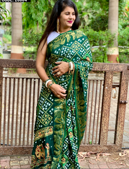 Green color pure hand bandhej silk saree with zari weaving work