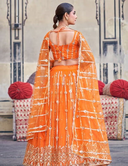 Orange Net Semi-Stitched Lehenga and Unstitched Blouse with Dupatta