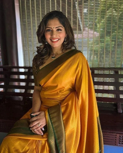 Bewitching Yellow Soft Silk Saree with Lissome Blouse Piece