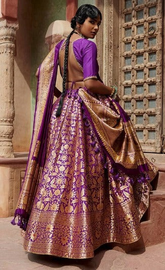 Weaver Story Women Purple Pure Silk Printed Floral V Neck Bageecha Banarasi Lehenga Set For Women