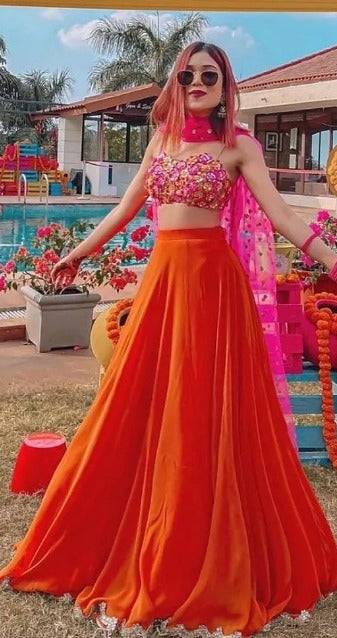 Orange ceremonial lehenga choli with heavy work blouse