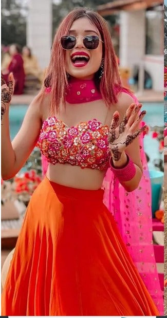 Orange ceremonial lehenga choli with heavy work blouse