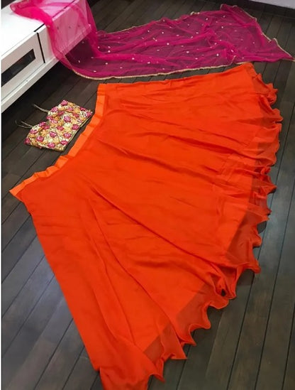 Orange ceremonial lehenga choli with heavy work blouse