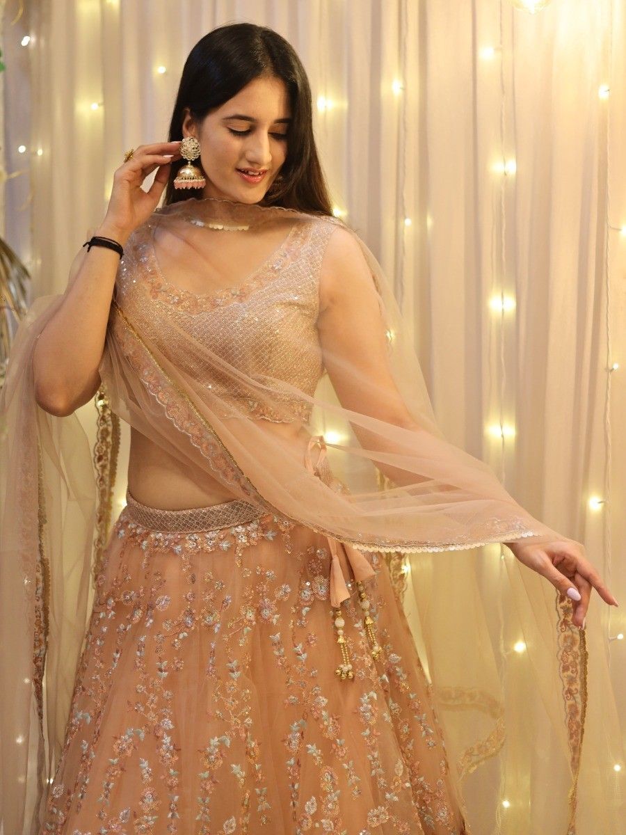 Enticing Peach Sequins Net Wedding Wear Lehenga Choli With Dupatta