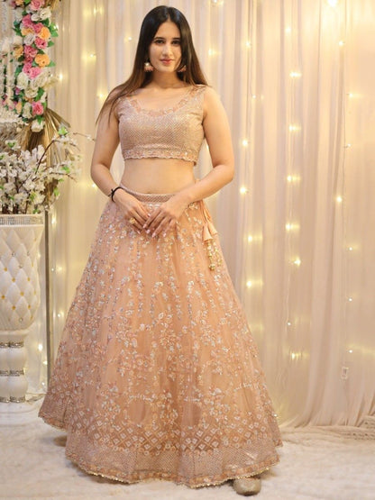 Enticing Peach Sequins Net Wedding Wear Lehenga Choli With Dupatta