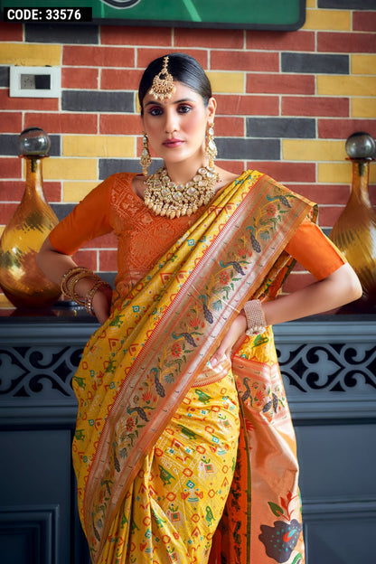 Yellow color patola silk saree with zari weaving work