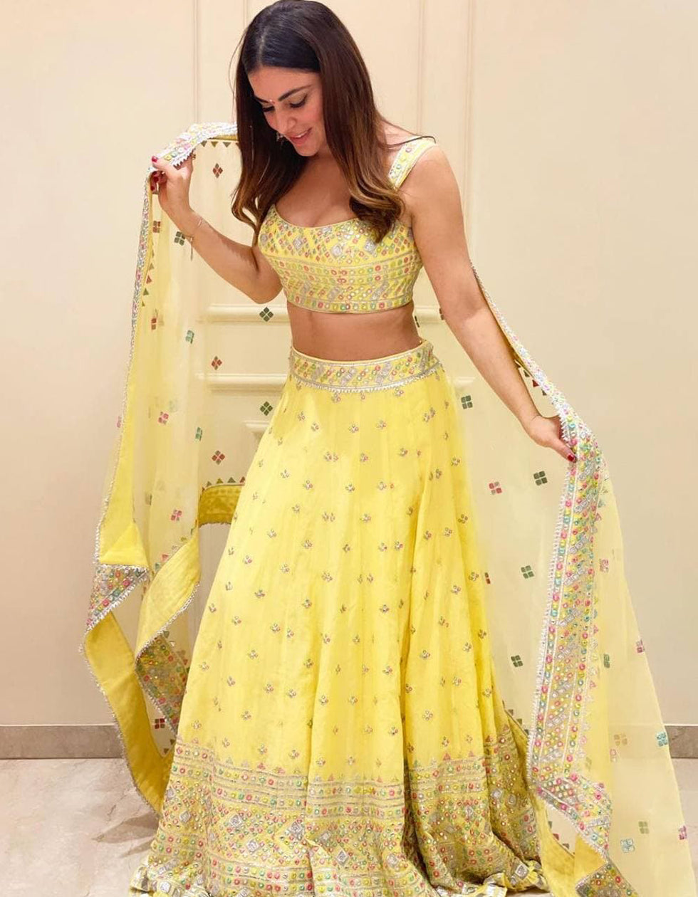 Dhavni Bhasushali Yellow Georgette Embroidery Bollywood Wear Lehenga Choli