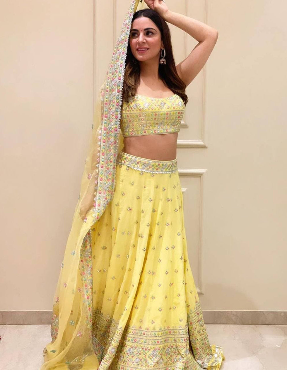 Dhavni Bhasushali Yellow Georgette Embroidery Bollywood Wear Lehenga Choli